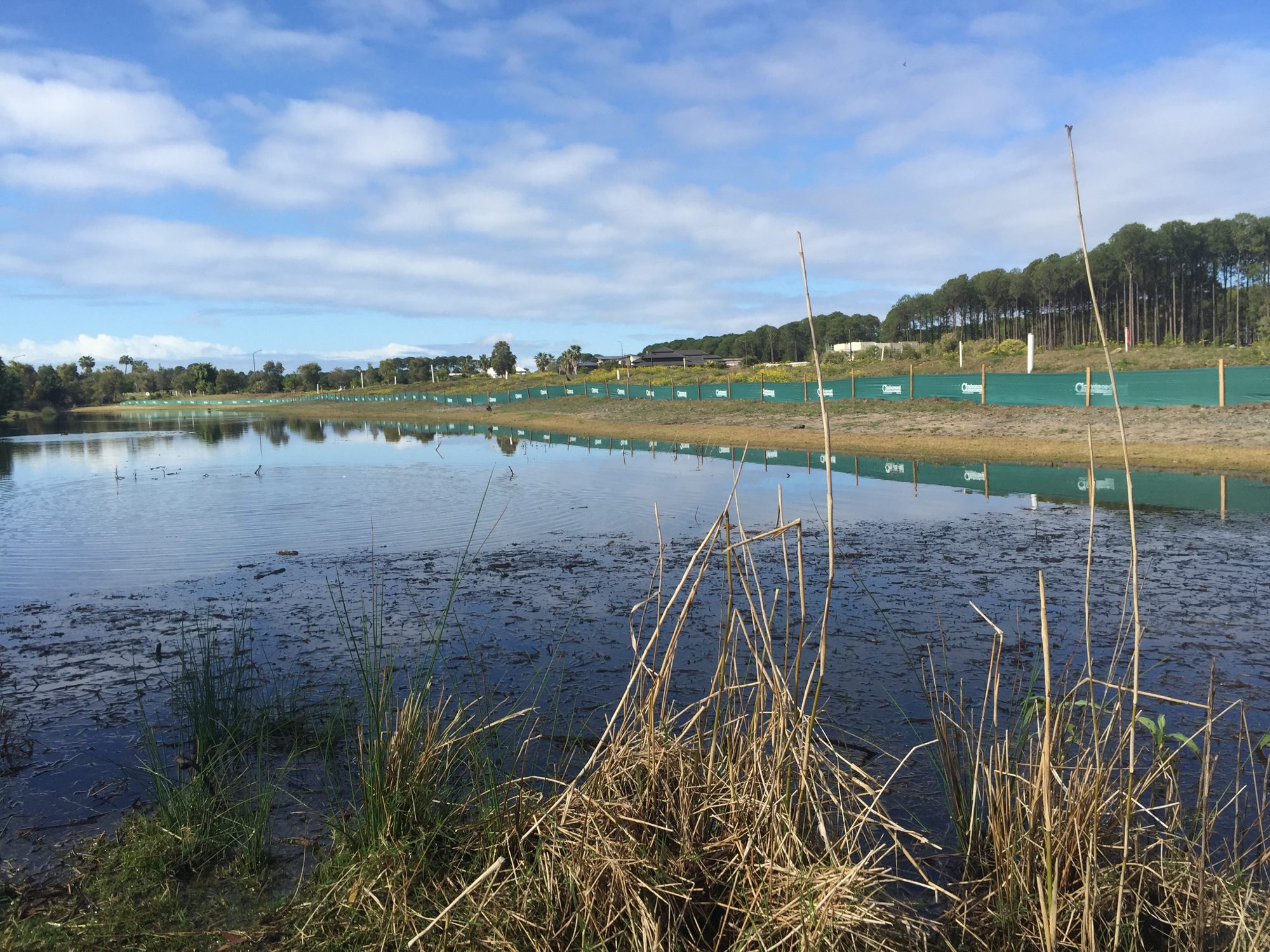 Silt and sediment controls protecting a waterway