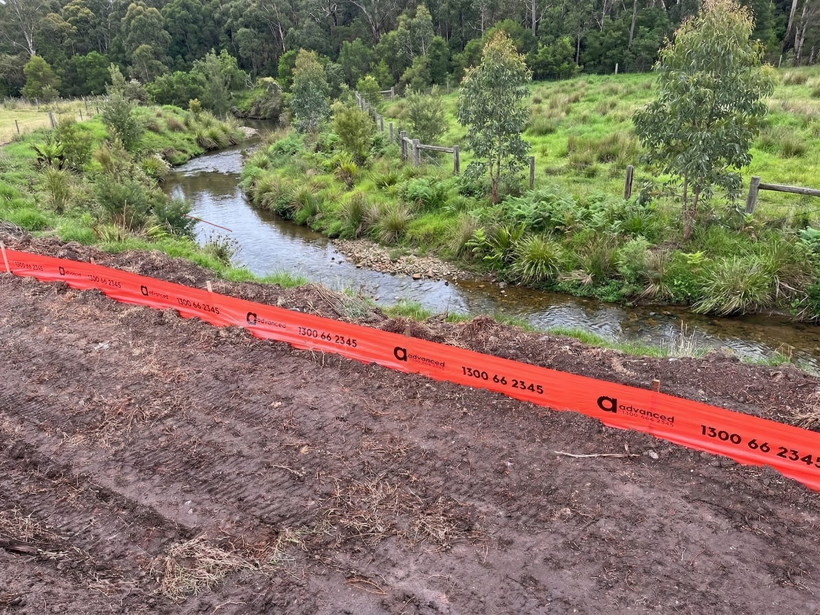 Silt fencing controlling sediment runoff on a construction site